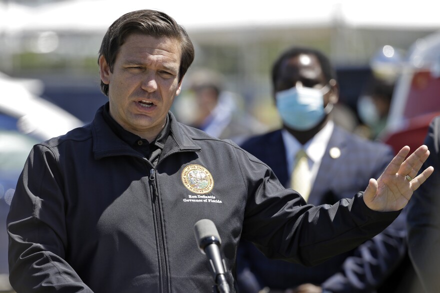 Florida Gov. Ron DeSantis speaks during a coronavirus news conference Tuesday, May 5, 2020, in Sarasota, Fla. Florida has set up a state run COVID-19 testing site at the University Town Center mall in Sarasota. (AP Photo/Chris O'Meara)