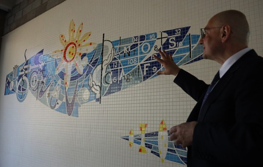Delta-X CEO Derek Dlugosh-Ostap remarks on the craftsmanship of a mosaic that was unearthed at a former Kodak research building he is rehabilitating. He said he plans to preserve the mural.