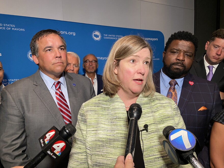 Mayor Nan Whaley (D-Dayton) speaks to reporters after the US Conference of Mayors luncheon, flanked by Mayor Andrew Ginther (D-Columbus, left) and Mayor Tito Brown (D-Youngstown).