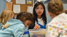 Sheccid Ramirez colors with kids before camp starts at Mountain Top Explorium in Breckenridge on June 10, 2025. Ramirez is heading to the University of Northern Colorado next year to study education and secured an internship with the education nonprofit for the spring and summer.