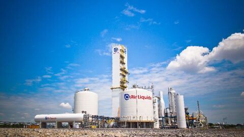 Air Liquide industrial gas facility in Louisiana with storage tanks and air separation unit equipment under blue sky.