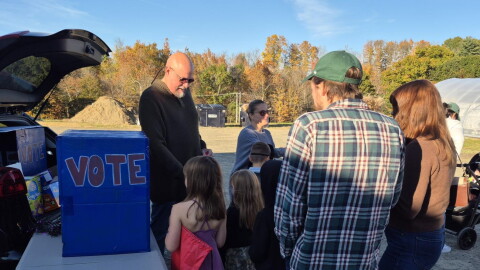 Democratic candidate for New York state Senate Devin Lander campaigns at a ‘Trunk or Treat’ event on Sunday, Oct. 18, 2026 in Rensselaer County, just outside Troy. Lander is vying to unseat incumbent Republican Sen. Jake Ashby.