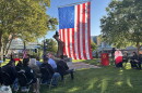 Dozens of people gather at Wentworth Park in downtown Lansing for the Lansing Remembers 9/11 ceremony marking the 25th anniversary of the Sept. 11 terrorist attacks, Sept. 11, 2026.