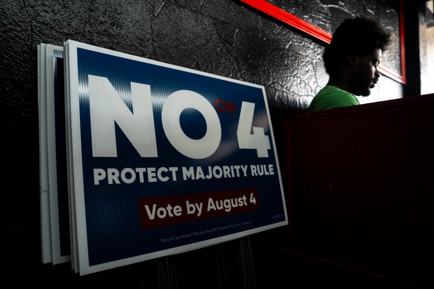 Alphanse Boure, right, pauses while joining his family in canvasing against Amendment 4 at Stevie’s Jailhouse Kitchen on Sunday, Aug. 2, 2026, in St. Louis’ Baden neighborhood.