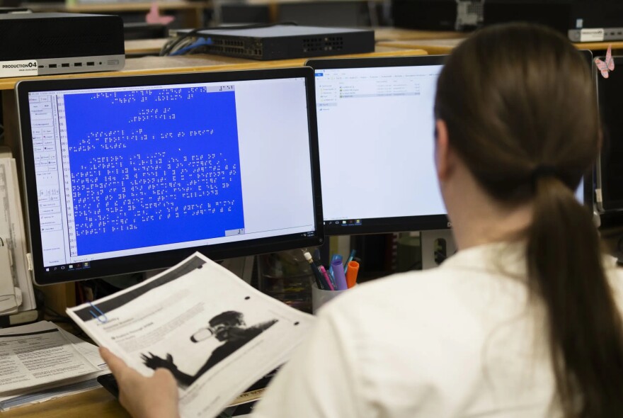 An inmate transcribes a math textbook into braille in the Billman Braille Center at the Patrick O'Daniel Unit.