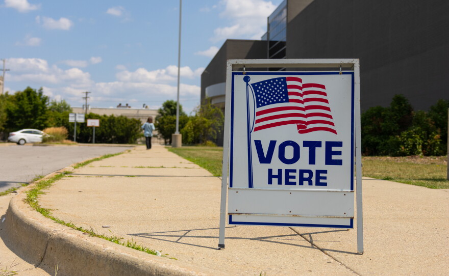 A voter makes her way inside Saginaw United high school to cast her ballot in the August 4 primary election.