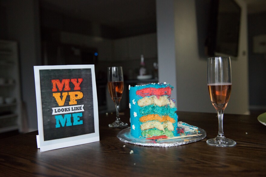 A cake, a glass of sparkling grape juice and other party props sit on a table at an Inaugration Day party at the Golla household in Chesterfield, Mo. Although the past year has been challenging, a high point for the South Asian community was to see Kamala Harris take the oath as vice president.