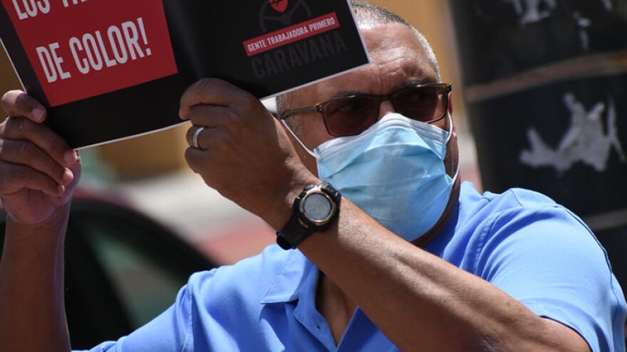Democratic gubernatorial candidate Dr. Woody Myers wears a face mask during a union-organized rally in support of the Black Lives Matter movement.