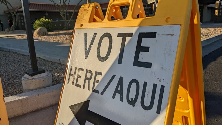 A sign points toward a vote cente