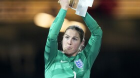 England's goalkeeper Mary Earps applauds after receiving the Golden Glove award for the tournament's best goalkeeper, at the end of the Women's World Cup soccer final between Spain and England in Sydney, Australia, Sunday, Aug. 20, 2023.