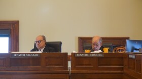 Salazar and Driskill sit at a committee meeting