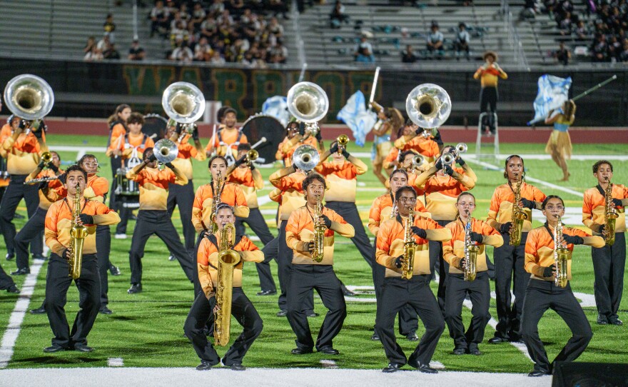 Students from Charles W. Flanagan High School's marching band, The Falcon Sound, perform in 2025.