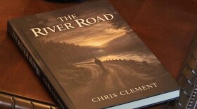 A copy of “The River Road” by Chris Clement.