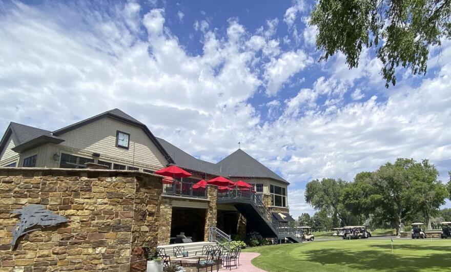 The clubhouse and practice putting green at the Logan Country Club.