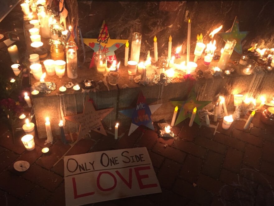 Candles at the base of the statue of U.Va. founder Thomas Jefferson.