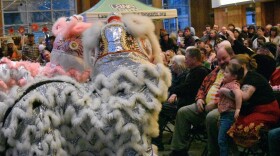 Audience watches two Dancing Lions