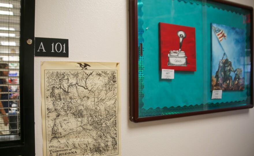 Outside Mr. DeDecker's classroom hangs a historical map of Arizona and student art.