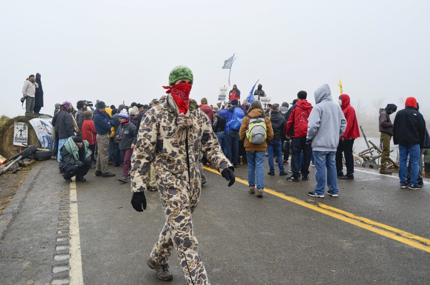 Protesters surround the Rev. Jesse Jackson on Highway 1806 on Thursday.