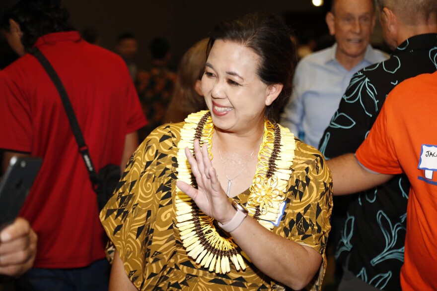 Jill Tokuda, Democratic candidate in the state's 2nd Congressional District, waves to people at a Democratic gathering Tuesday, Nov. 8, 2022, in Honolulu. (AP Photo/Marco Garcia)