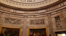 The dome and murals of the US Capitol building. 