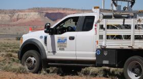 A Salt River Project truck is parked at a job site in Cornfields on the Navajo Nation.