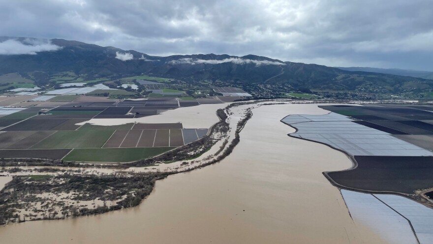 Water from the Salinas River seen breaching levees and flooding fields in Chualar on Jan. 13, 2023.