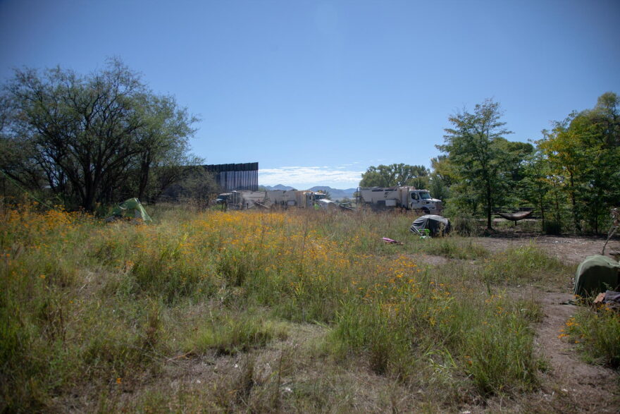Contractors with Fisher Sand & Gravel work on a 30-foot bollard fence in Lochiel, Arizona on Oct. 7, 2026.