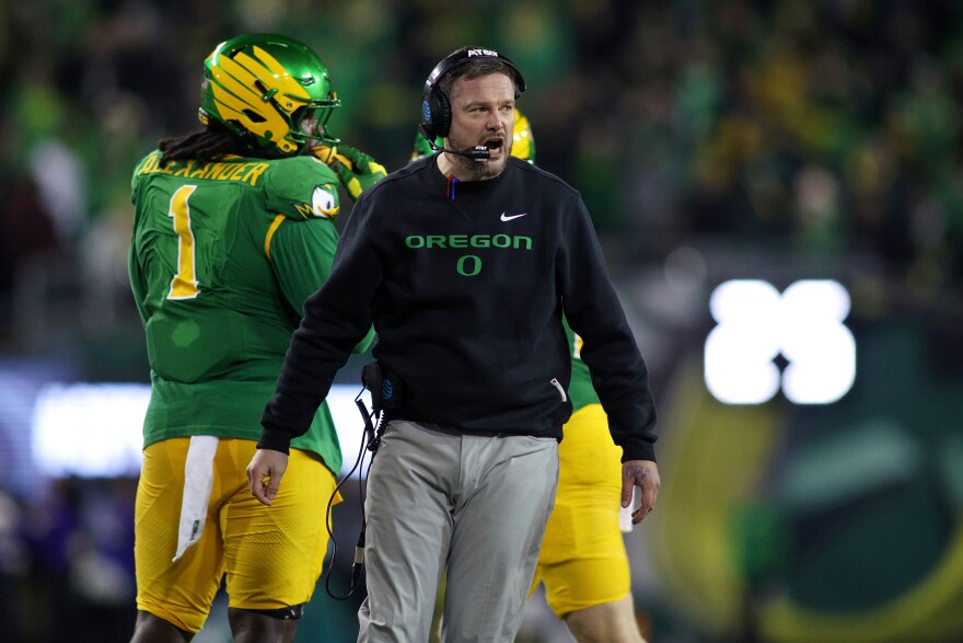 Oregon head coach Dan Lanning calls to his team during the first half of the first round of the NCAA College Football Playoff against James Madison, Saturday, Dec. 20, 2025, in Eugene, Ore.