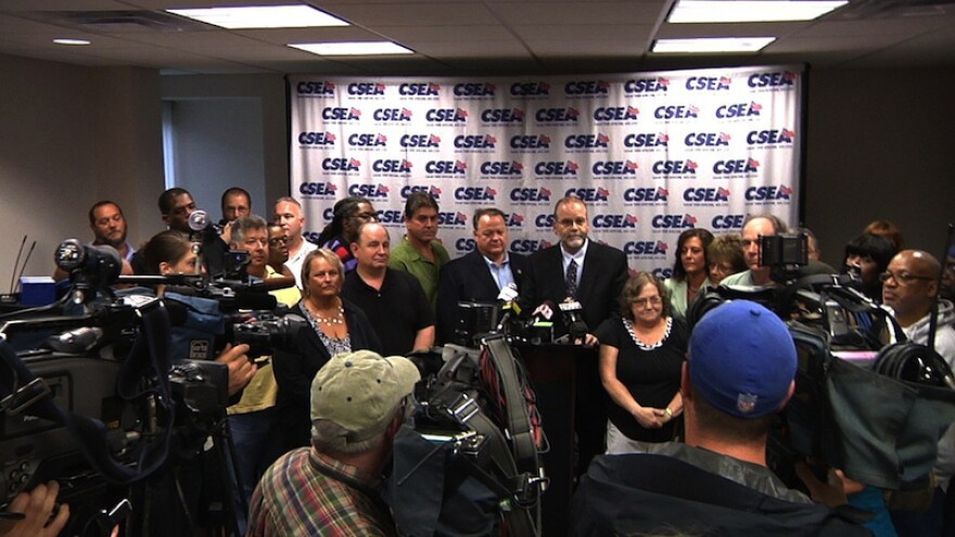 CSEA President Danny Donohue surrounded by the CSEA State Negotiating Team members after reaching tentative deal in June