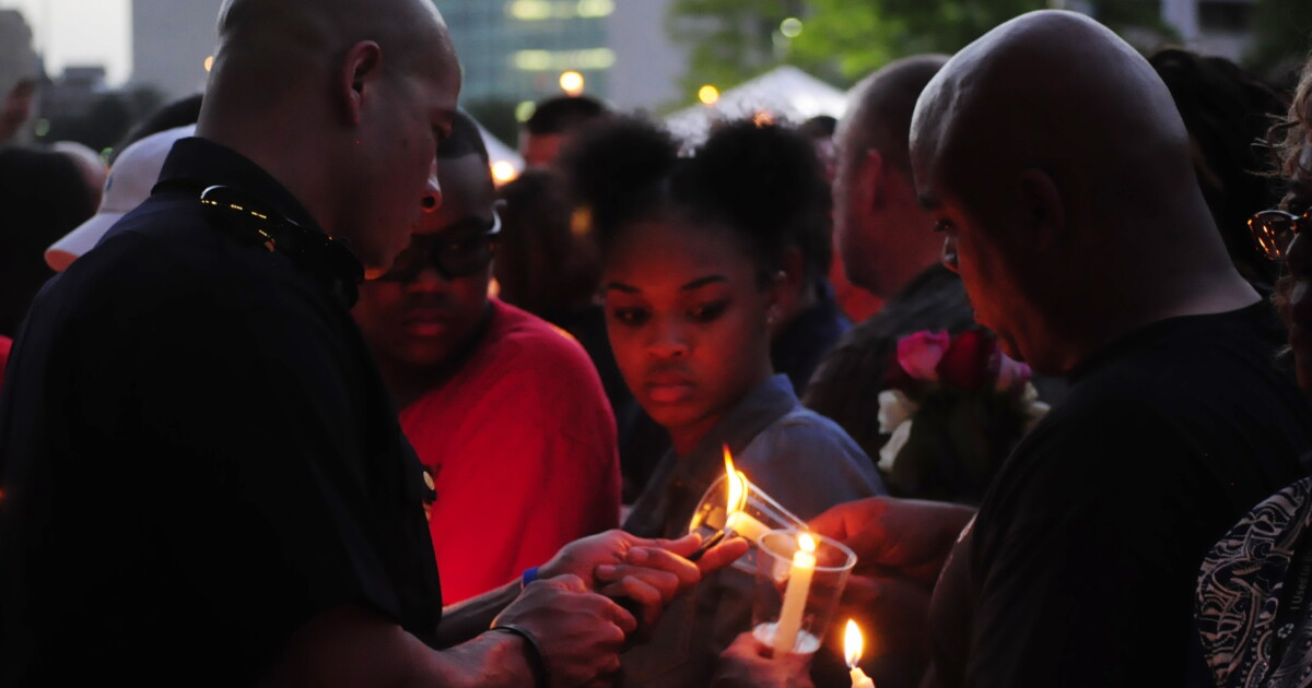 At Candlelight Vigil, Fond Memories Of Fallen Police Officers | KERA News