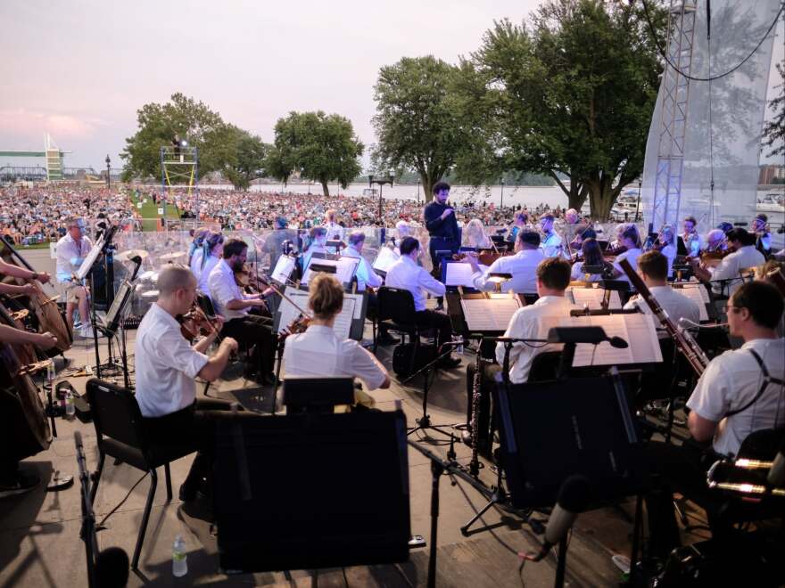 QCSO assistant conductor Hisham Bravo Groover conducts Riverfront Pops on the riverfront in Davenport's LeClaire Park.