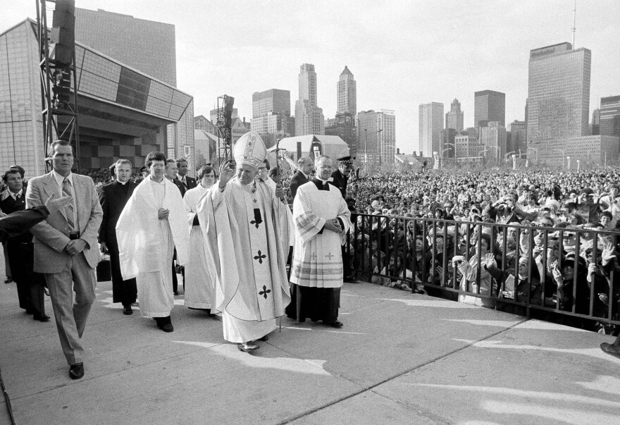 Pope John Paul II acknowledges the crowd gathered in Chicago's Grant Park before celebrating an outdoor Mass on Oct. 5, 1979.