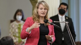 Assemblymember Buffy Wicks speaking into a microphone.