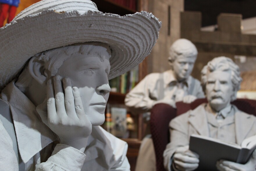 Statues of Tom Sawyer and Mark Twain at the Mark Twain Boyhood Home and Museum in Hannibal
