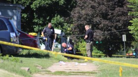 Officers from the Peoria Police Department work on the scene of a shooing in Peoria's South Side Thursday morning.