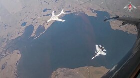 A Russian fighter and Chinese bomber flying through international airspace off Alaska.