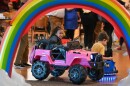 Stella Sutton, 6, drives a customized toy Jeep at King’s College.