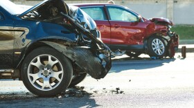 car crash accident. Car collision on city street. Two damaged automobiles