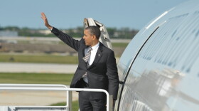 President Barack Obama boards Air Force One at Chicago's O'Hare airport on May 21, 2012. The president has gone on the attack about his opponent's time at Bain Capital.