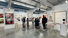 People chat and look at available works during the Intersect Aspen Art and Design Fair at the Aspen Ice Garden on Thursday, Aug. 2, 2044. The fair features dozens of galleries, including a few local exhibitors, as well as several panels on the art world.