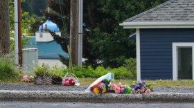 Some people have set flowers down near where they believe the victim was found, July 17, 2023. (Brian Venua/KMXT)