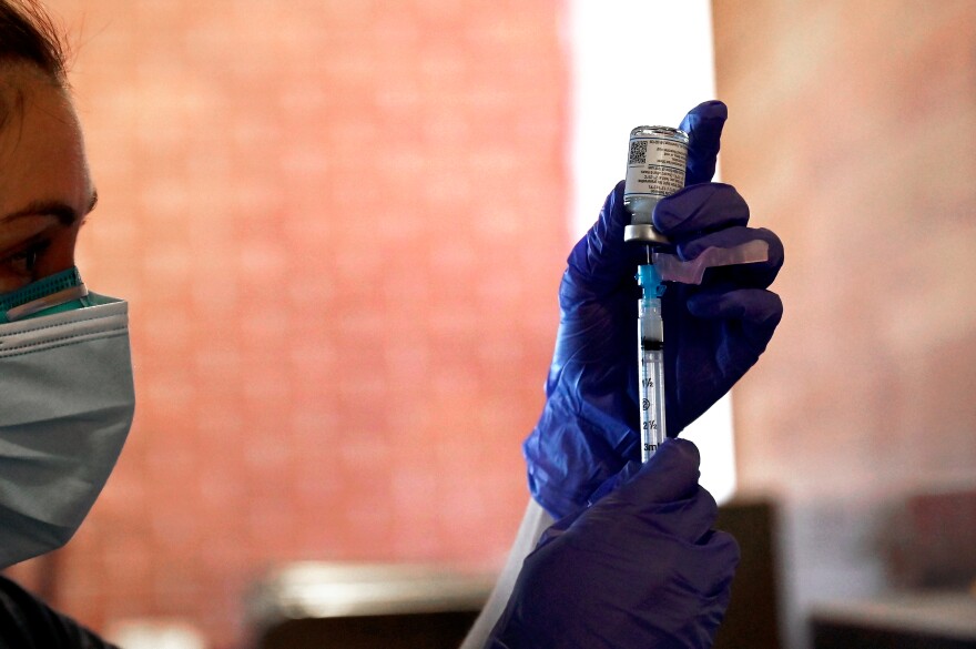 RN Jenni Eckstrom draws 0.5 ml of the Moderna COVID-19 vaccine as the City of Hartford’s Department of Health and Human Services hosted a vaccine clinic for Hartford residents 75 and over at Dunkin’ Donuts Park in Hartford on February 06, 2021