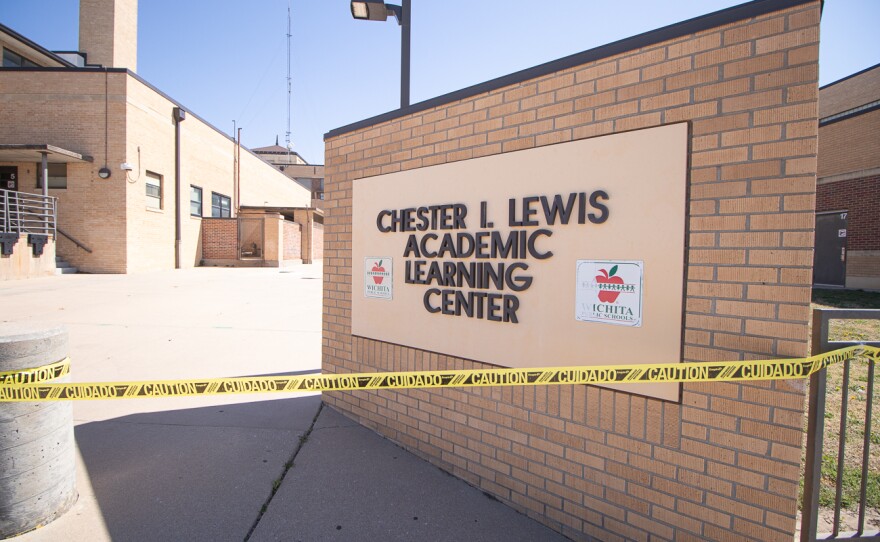 Caution tape blocks the rear entrance of the Chester I. Lewis Academic Learning Center.