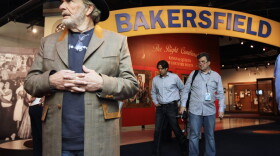 The late Merle Haggard, left, views an exhibit on the Bakersfield sound at the Country Music Hall of Fame and Museum in Nashville, Tenn. (Mark Humphrey/File/AP)