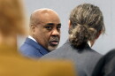 Duane Davis, center, chats with his attorney Michael Sanft during the fourth day of jury selection for his murder trial in Clark County District Court at the Regional Justice Center on Thursday, Aug. 13, 2026, in Las Vegas. Davis was indicted on murder charges for his involvement in the killing of rapper Tupac Shakur in 1996. (Bizuayehu Tesfaye/Las Vegas Review-Journal via AP, Pool)