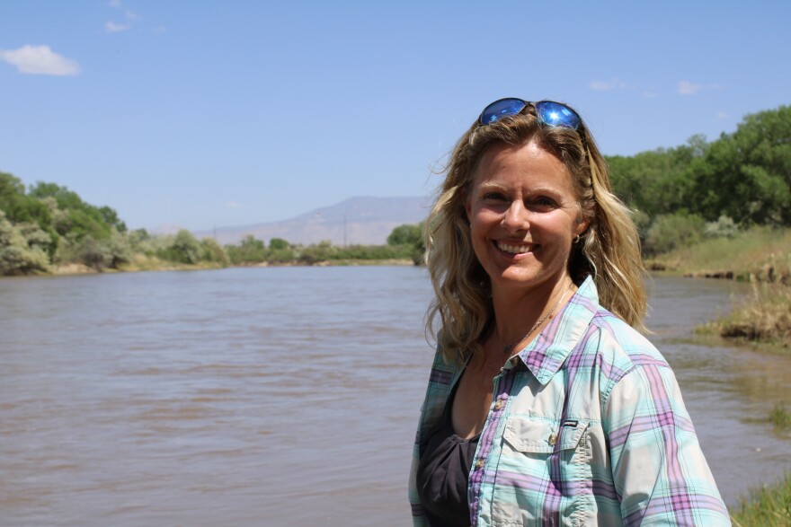 Abby Burk of Audubon Rockies stands on the banks of the Colorado River in Grand Junction, Colorado, on May 13.