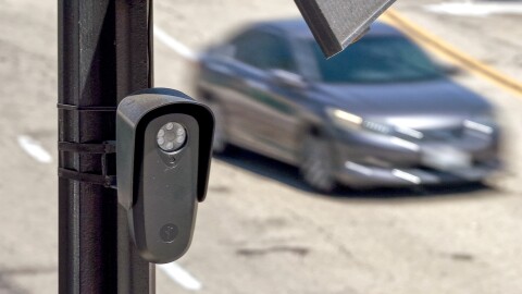 An aerial view of a Flock Safety camera mounted to a light pole on August 03, 2026 in Burbank, California. Flock Safety's automated license plate reader cameras have been deployed in over 120,000 locations across 49 states, using artificial intelligence to identify vehicles by their license plates, make, model and color to help law enforcement investigate crimes, while also drawing criticism from privacy advocates over concerns about mass surveillance and the collection of motorists' location data.