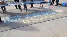Chalk message that reads "Your Community Has Your Back #Spartans"