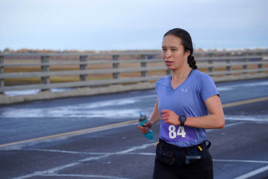 Claire Trujillo crosses the Kenai River well ahead of the pack in the Kenai River Marathon on Sunday, Sept. 27, 2026, at the Warren Ames Memorial Bridge in Kenai, Alaska.