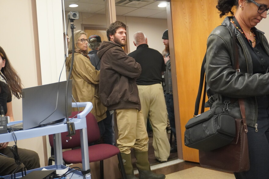 A Clearfield County employee led several people out of the meeting room after they heckled commissioners. 